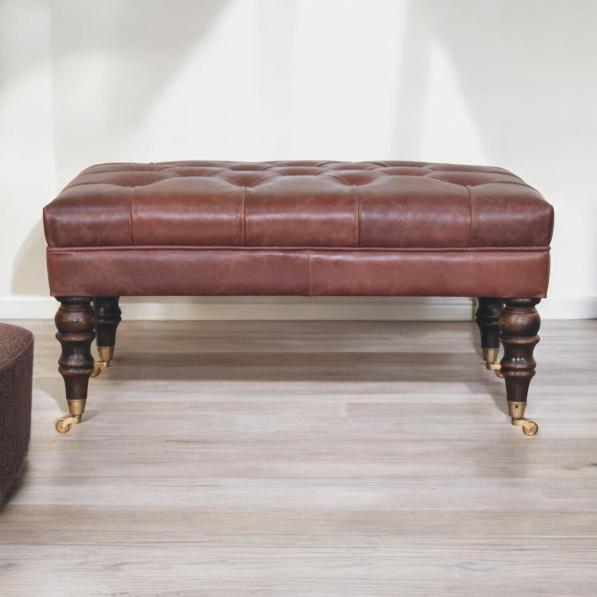 Sutton Buffalo Leather Brown Tufted Ottoman with Castor Legs